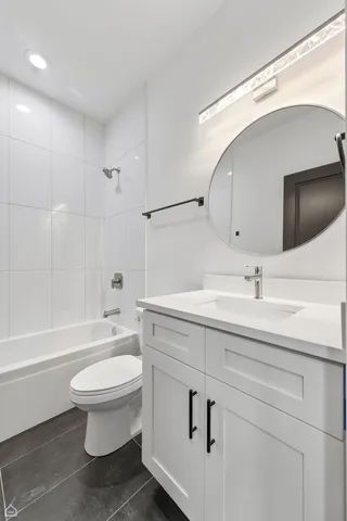 a bathroom with a sink a toilet and a bathtub