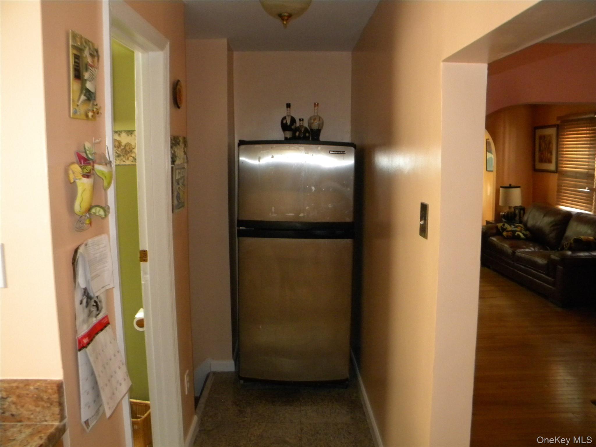 241-26 86th Road Queens, NY 11426 - Photo 12 of 38 a view of a hallway with wooden floor