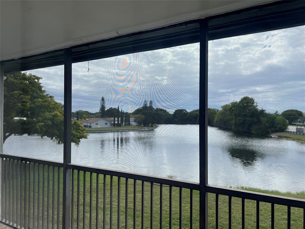 a view of a balcony with lake from a balcony
