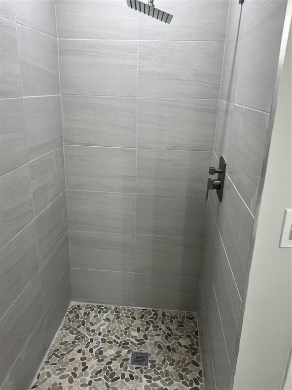 9920 Northwest 68th Place, Unit 210 Tamarac, FL 33321 - Photo 16 of 26 a bathroom with a shower