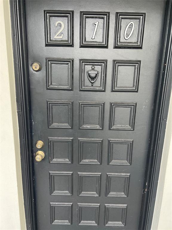 9920 Northwest 68th Place, Unit 210 Tamarac, FL 33321 - Photo 2 of 26 a view of a hallway with windows
