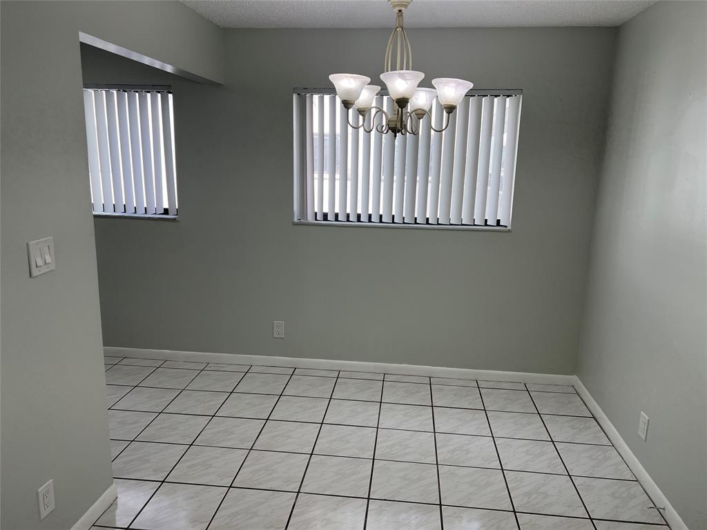 9920 Northwest 68th Place, Unit 210 Tamarac, FL 33321 - Photo 21 of 26 a view of an empty room with a window