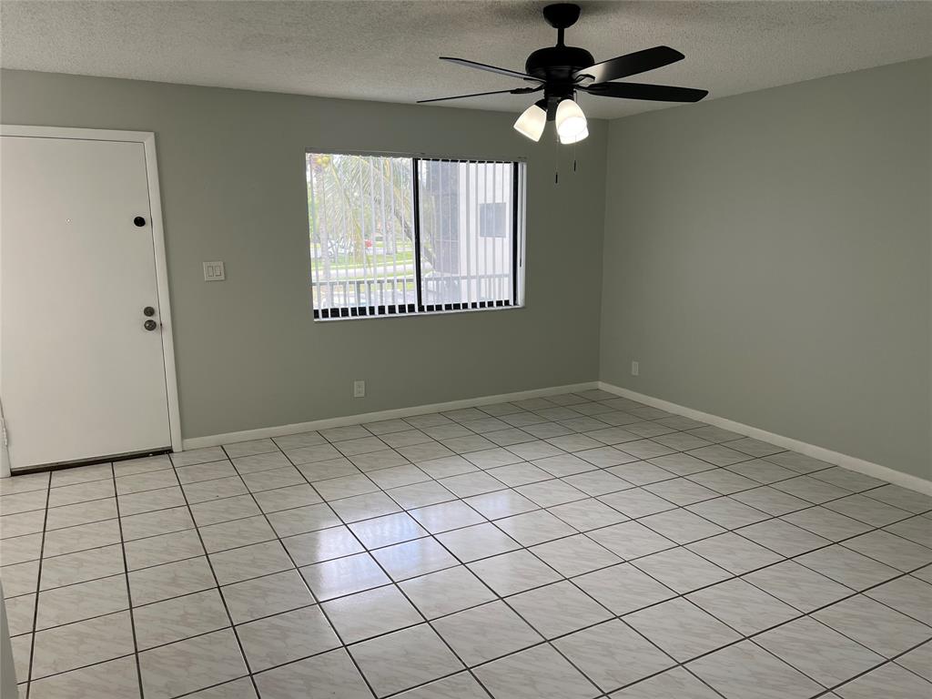 9920 Northwest 68th Place, Unit 210 Tamarac, FL 33321 - Photo 3 of 26 a view of an empty room and window