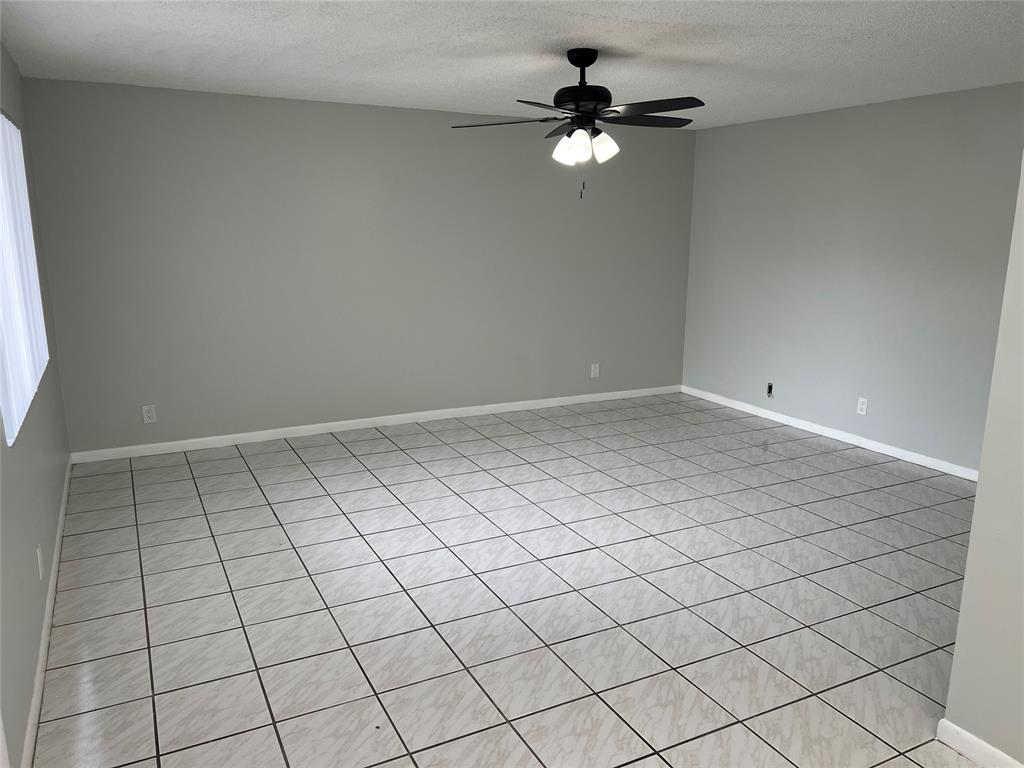 9920 Northwest 68th Place, Unit 210 Tamarac, FL 33321 - Photo 4 of 26 a view of an empty room