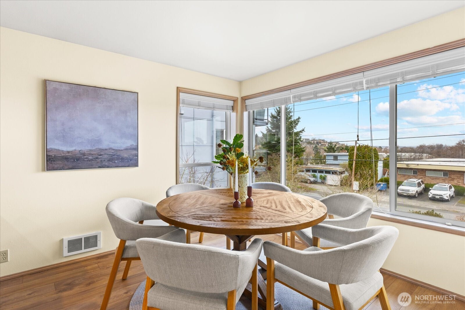 233 3rd Avenue South, Unit 305 Edmonds, WA 98020 - Photo 11 of 34 a dining room with furniture and wooden floor