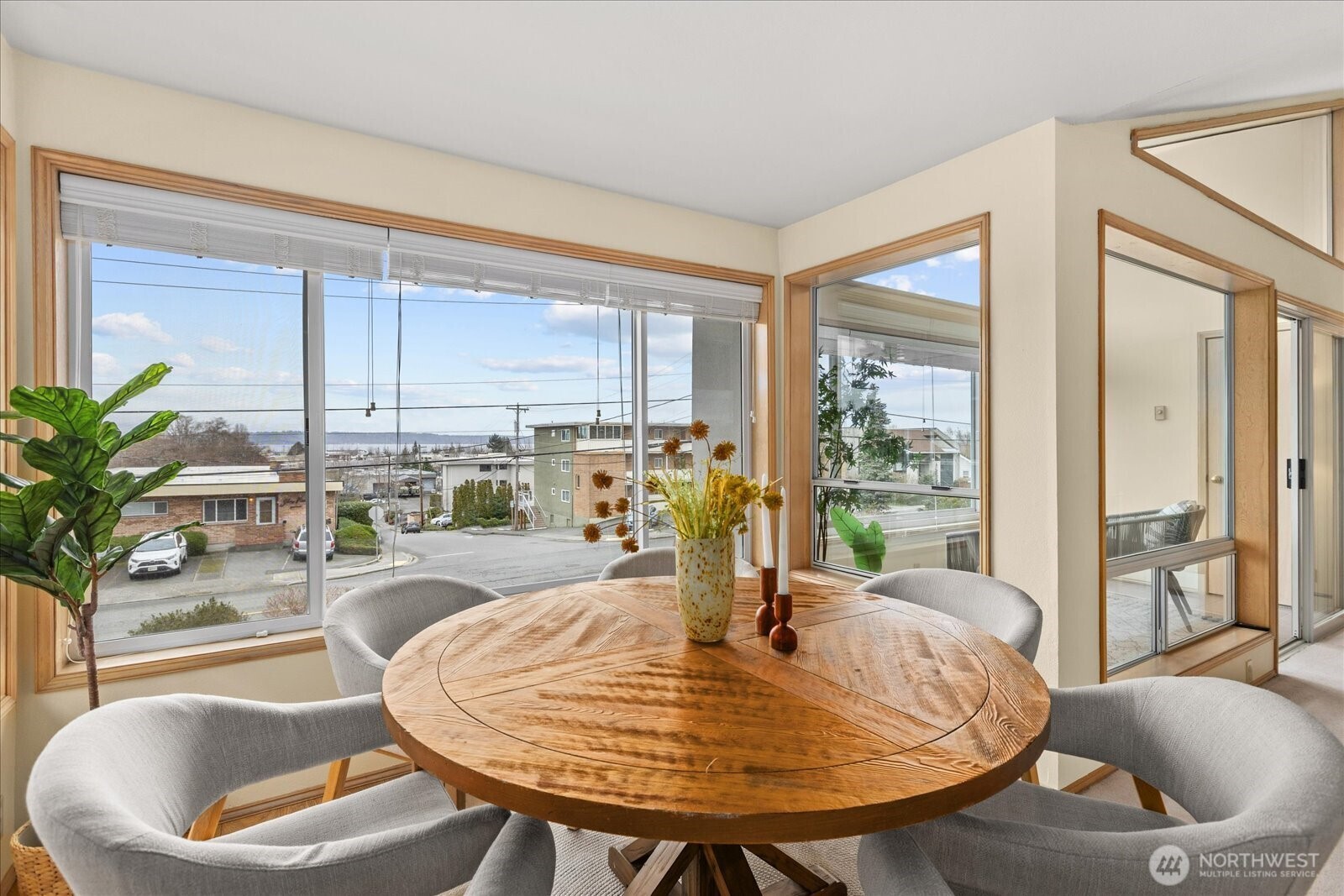 233 3rd Avenue South, Unit 305 Edmonds, WA 98020 - Photo 12 of 34 a dining room with furniture a chandelier and wooden floor