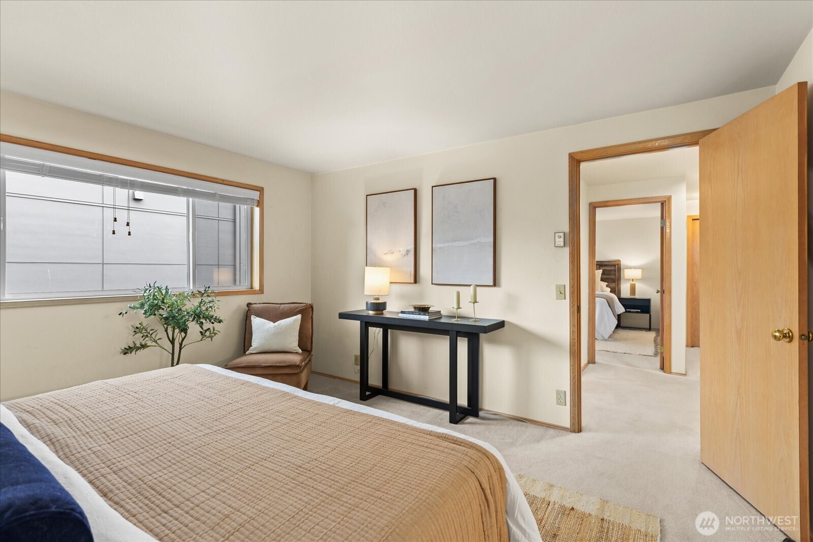 233 3rd Avenue South, Unit 305 Edmonds, WA 98020 - Photo 18 of 34 a bedroom with a bed and a table