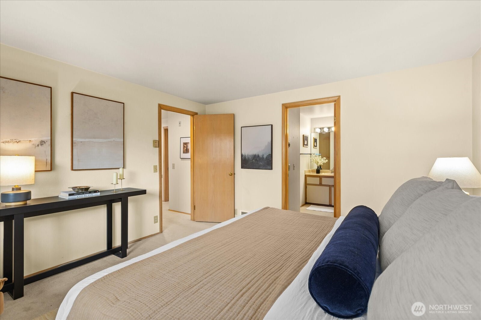 233 3rd Avenue South, Unit 305 Edmonds, WA 98020 - Photo 19 of 34 a spacious bedroom with a bed and cabinet