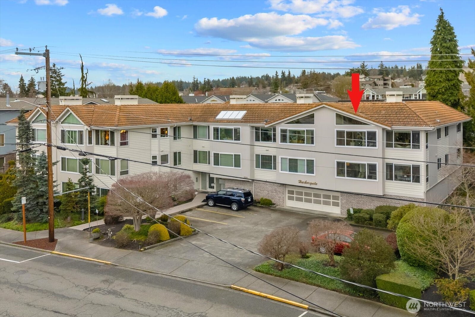 233 3rd Avenue South, Unit 305 Edmonds, WA 98020 - Photo 2 of 34 a front view of a house with a yard