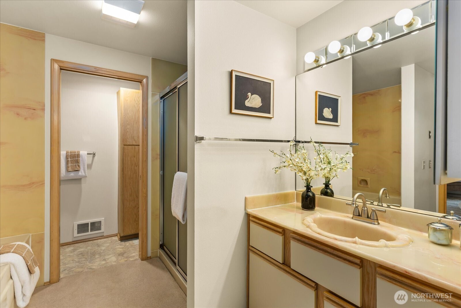 233 3rd Avenue South, Unit 305 Edmonds, WA 98020 - Photo 21 of 34 a bathroom with a double vanity sink mirror and shower