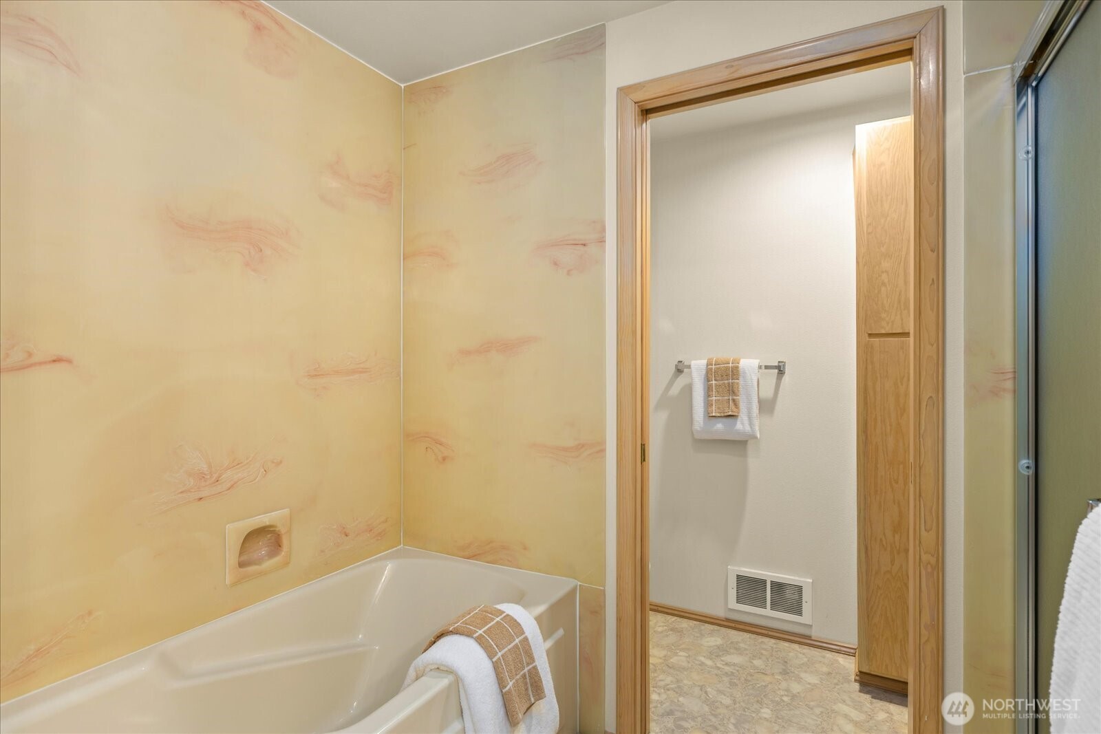 233 3rd Avenue South, Unit 305 Edmonds, WA 98020 - Photo 22 of 34 a bathroom with a bathtub and shower