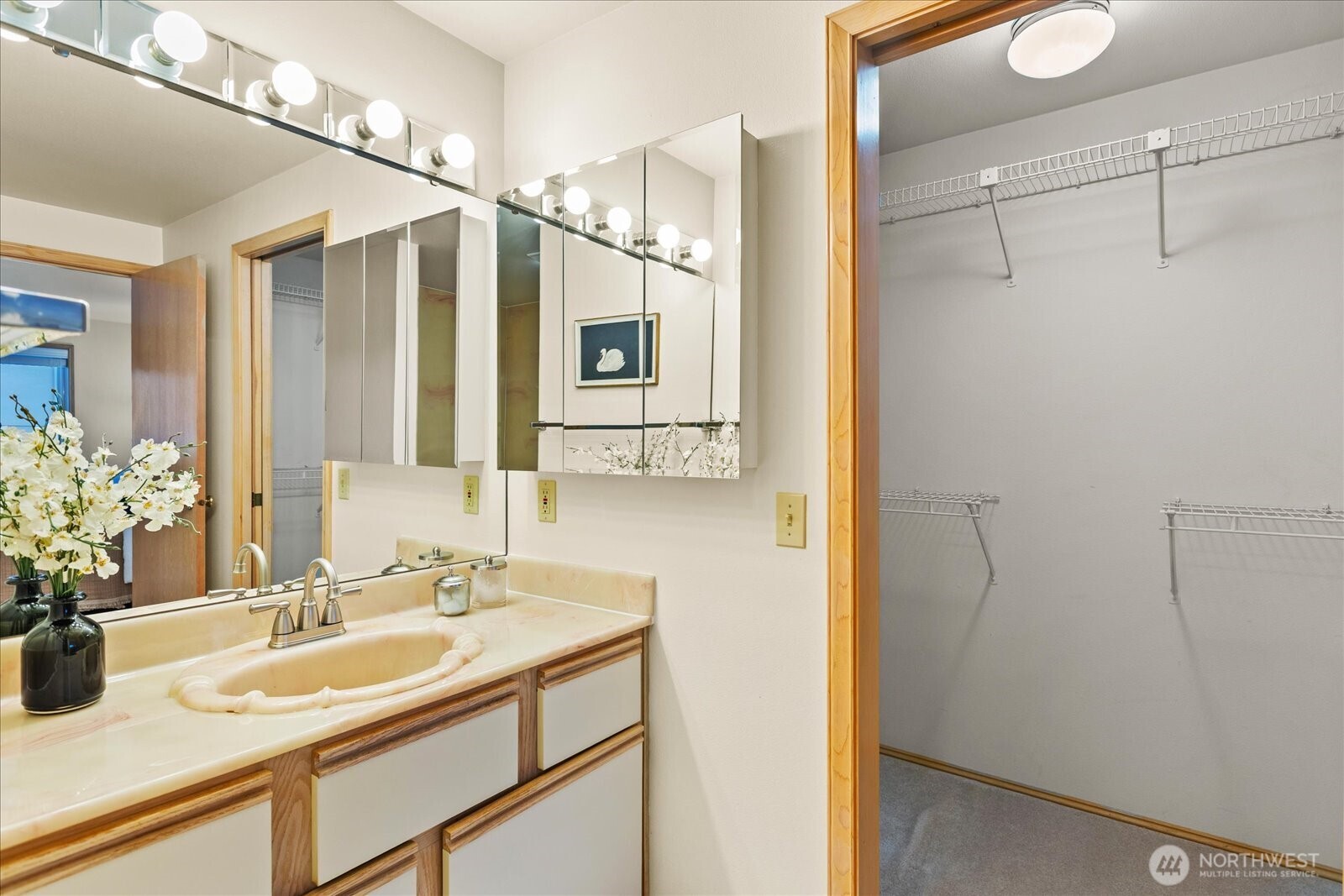 233 3rd Avenue South, Unit 305 Edmonds, WA 98020 - Photo 23 of 34 a bathroom with a sink and a mirror