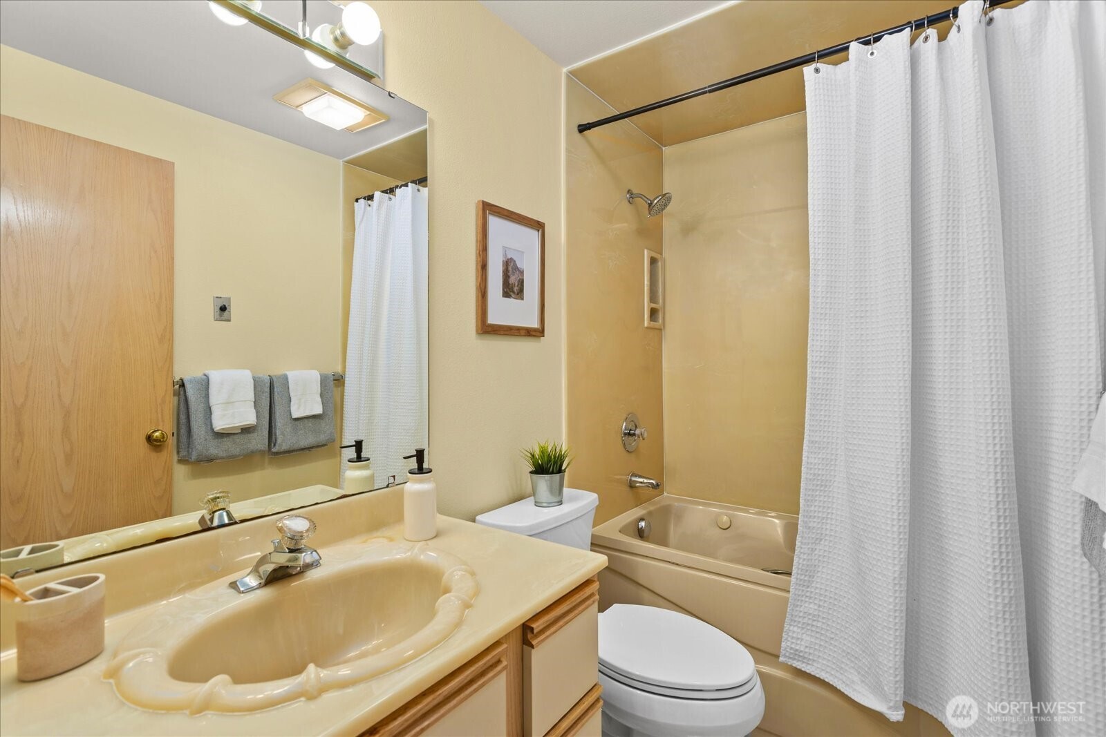 233 3rd Avenue South, Unit 305 Edmonds, WA 98020 - Photo 26 of 34 a bathroom with a sink toilet and shower