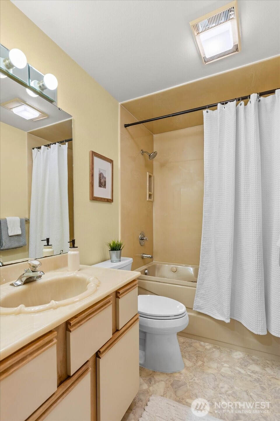 233 3rd Avenue South, Unit 305 Edmonds, WA 98020 - Photo 27 of 34 a bathroom with a sink a toilet and shower