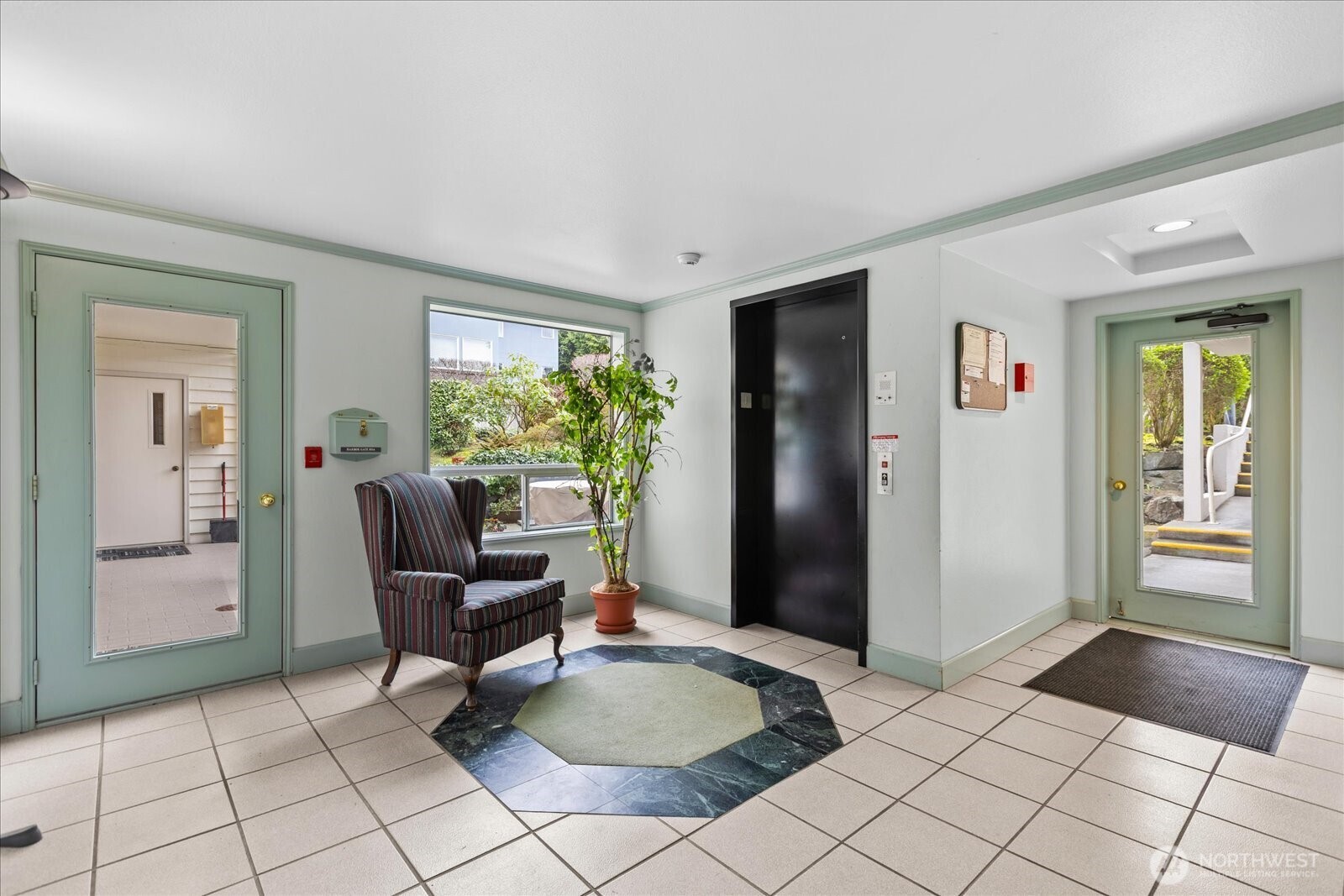 233 3rd Avenue South, Unit 305 Edmonds, WA 98020 - Photo 30 of 34 a living room with furniture and a window