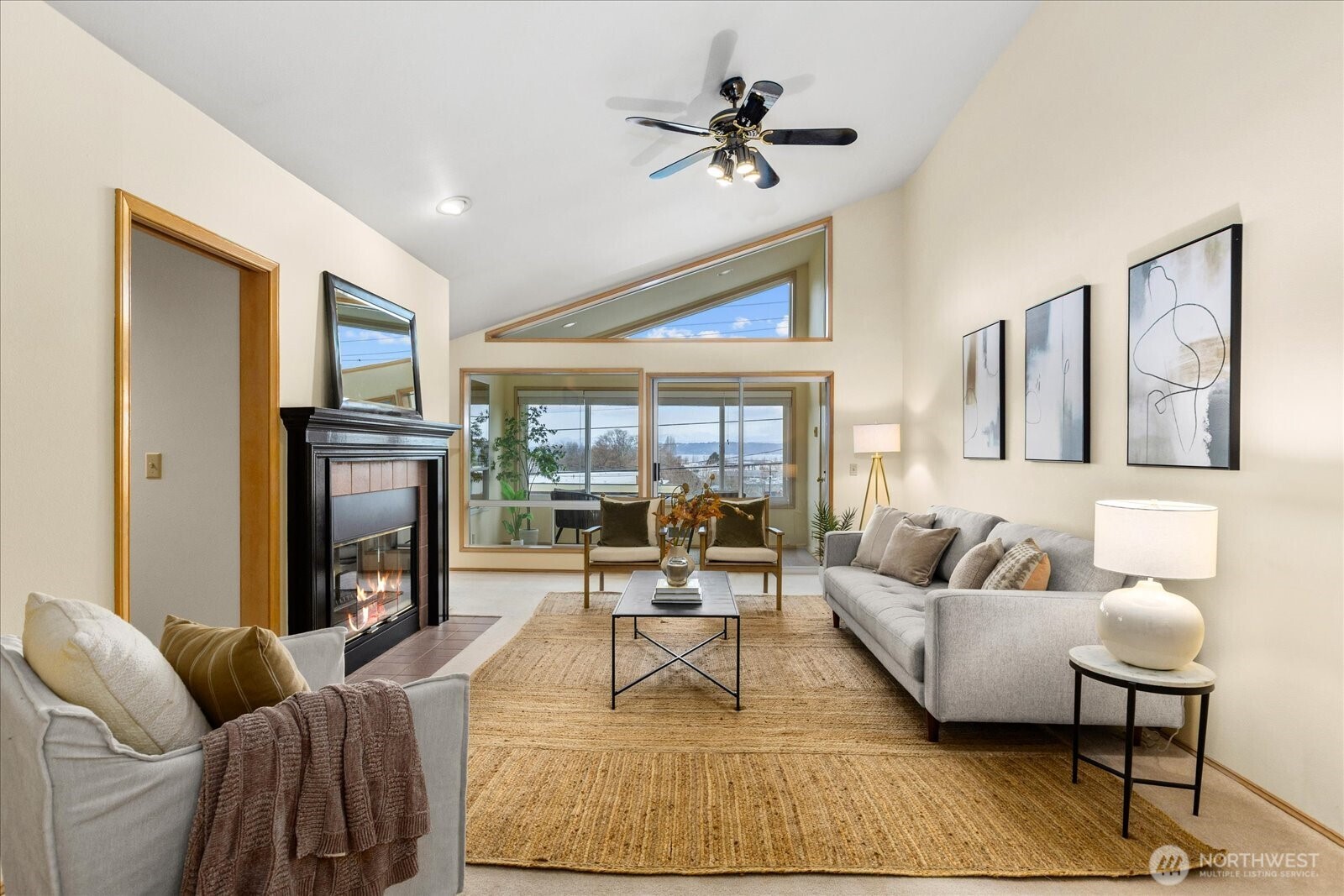 233 3rd Avenue South, Unit 305 Edmonds, WA 98020 - Photo 4 of 34 a living room with furniture and a fireplace