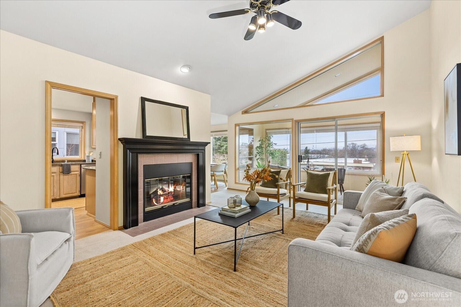 233 3rd Avenue South, Unit 305 Edmonds, WA 98020 - Photo 5 of 34 a living room with furniture and a fireplace