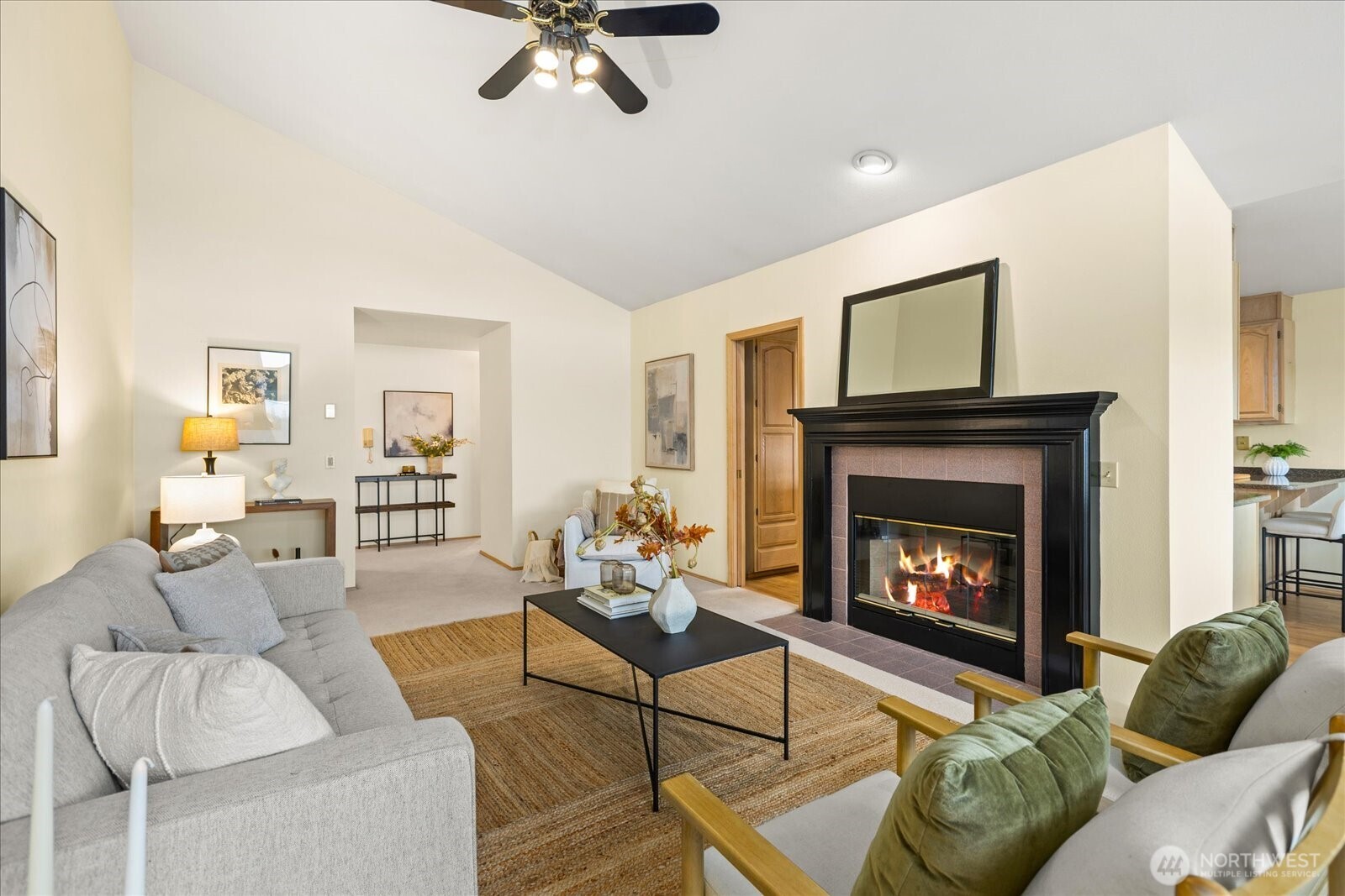 233 3rd Avenue South, Unit 305 Edmonds, WA 98020 - Photo 8 of 34 a living room with furniture and a fireplace