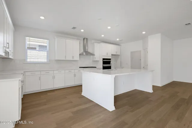 a view of a porch with a door and wooden floor