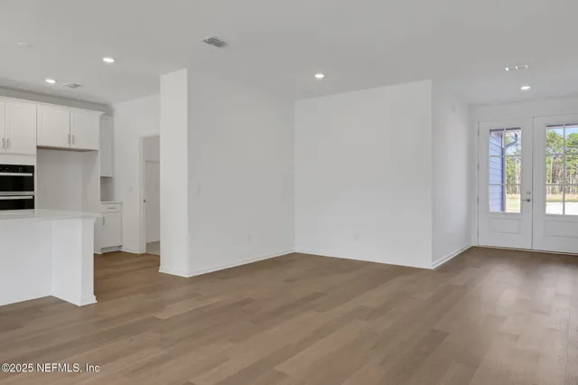 a living room with large windows