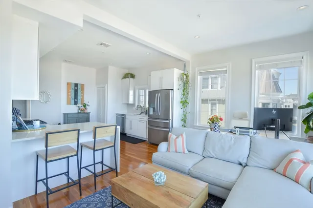 a living room with furniture and a table