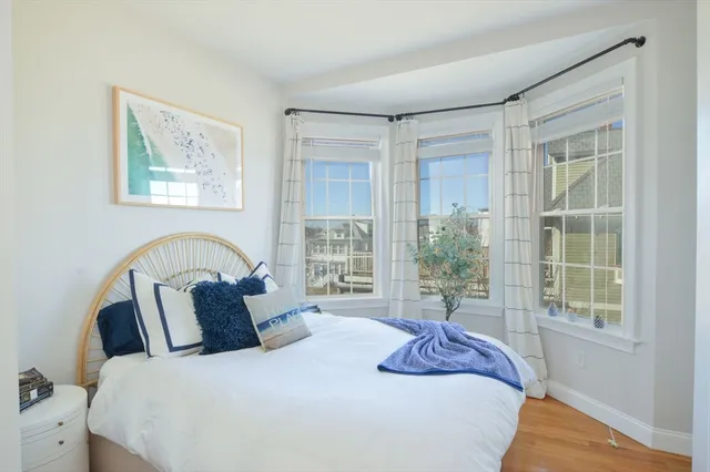 a bedroom with bed and a window