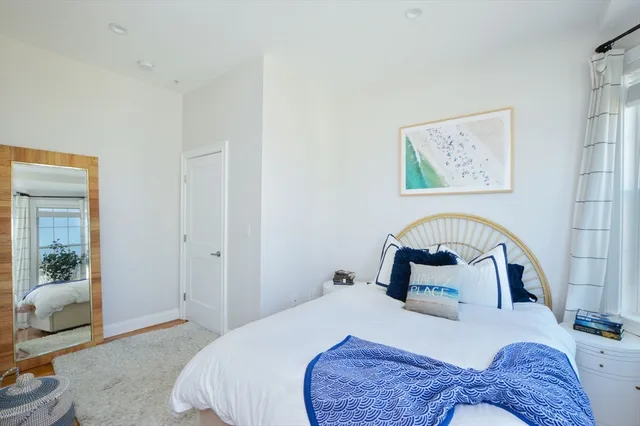 a bedroom with a bed and a couch