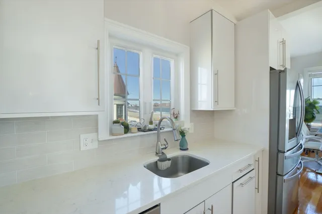 a kitchen with a sink and cabinets