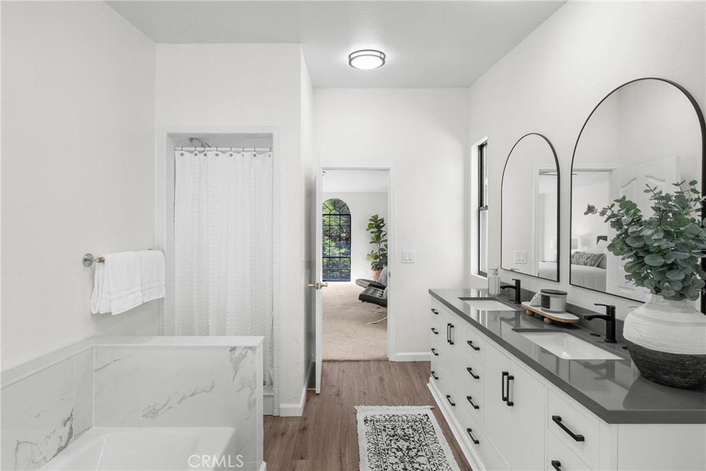 2146 Cowper Street Cambria, CA 93428 - Photo 18 of 46 Upstairs primary en-suite bath remodeled in 2025 with separate shower, soaking tub, fireplace, private toilet area and even a balcony!