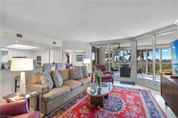 a living room with furniture and a rug