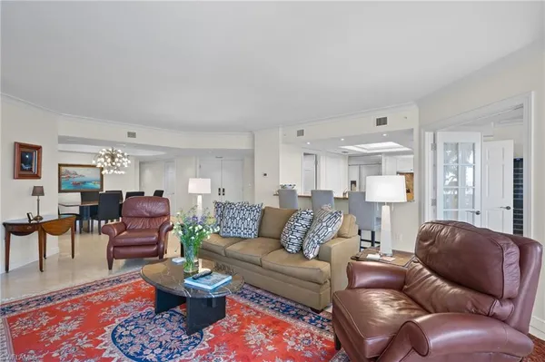 a living room with furniture and a rug