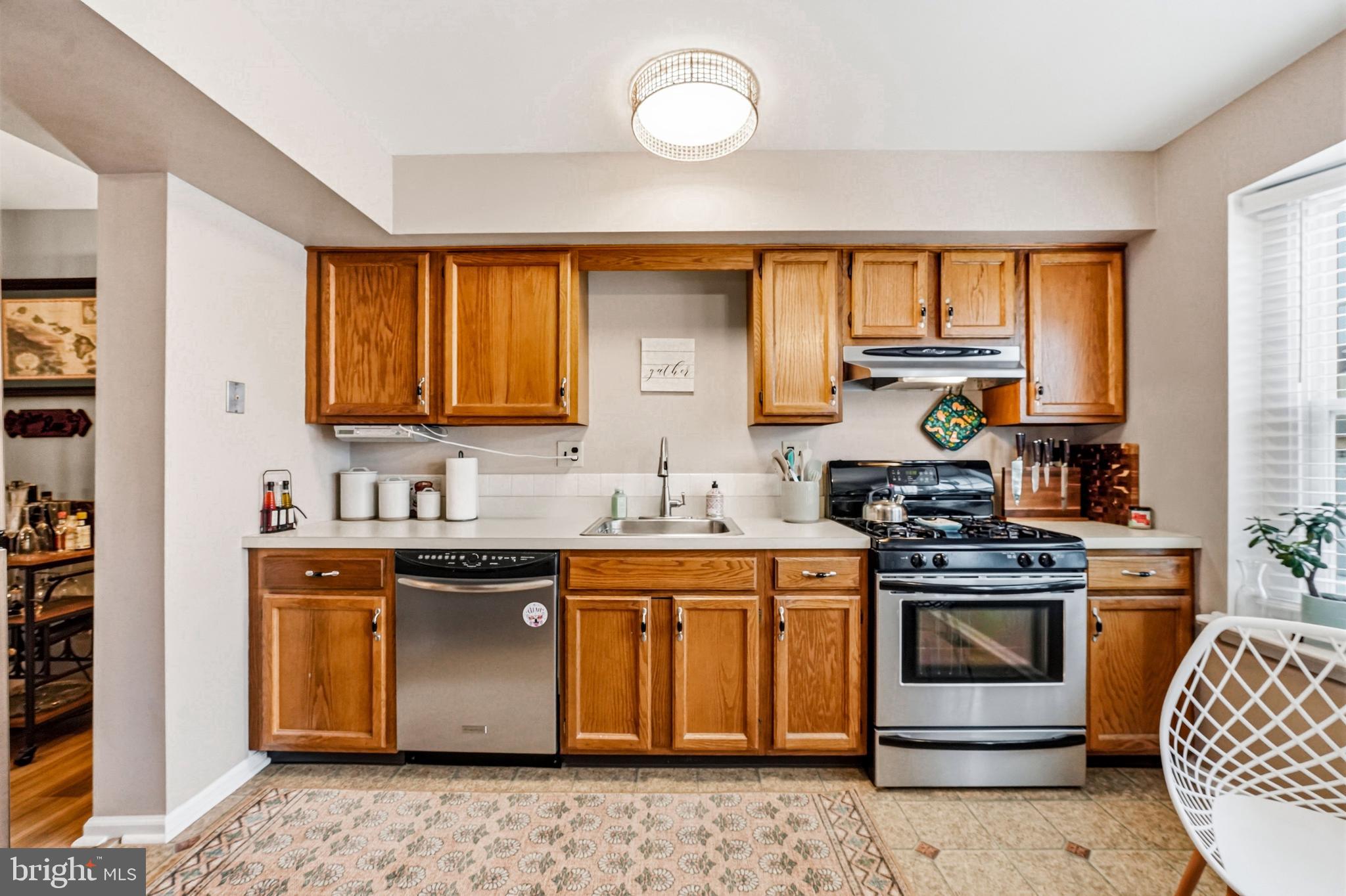 26 Blue Jay Drive Clementon, NJ 08021 - Photo 12 of 48 a kitchen with stainless steel appliances granite countertop a stove a sink and a microwave
