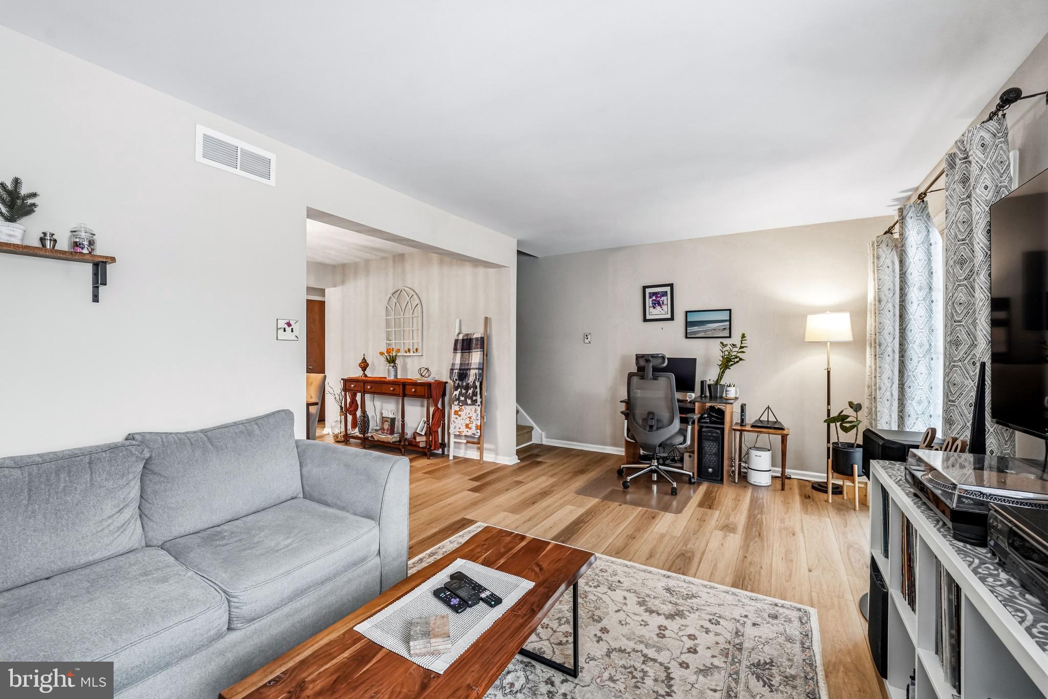 26 Blue Jay Drive Clementon, NJ 08021 - Photo 22 of 48 a living room with furniture and a flat screen tv
