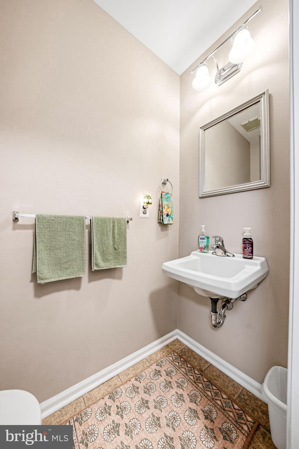 26 Blue Jay Drive Clementon, NJ 08021 - Photo 24 of 48 a bathroom with a sink and mirror with toilet