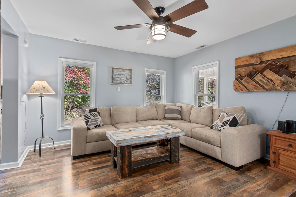 3391 Candy Mountain Road Murphy, NC 28906 - Photo 18 of 59 a living room with furniture a wall paintings and a window