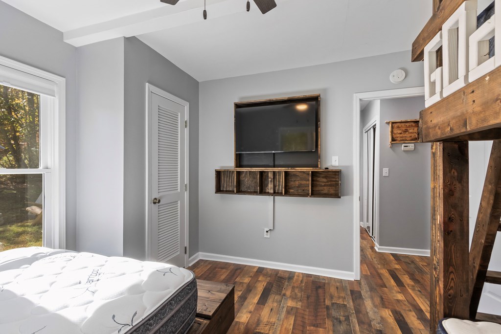 3391 Candy Mountain Road Murphy, NC 28906 - Photo 29 of 59 a bedroom with a bed and a flat screen tv