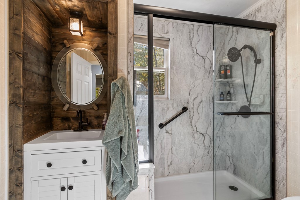 3391 Candy Mountain Road Murphy, NC 28906 - Photo 31 of 59 a bathroom with a sink a mirror and a shower
