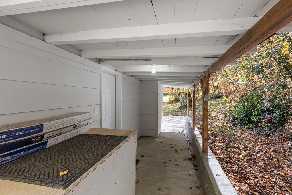3391 Candy Mountain Road Murphy, NC 28906 - Photo 35 of 59 a storage room with wooden floor and furniture
