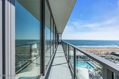 a view of a dining room with furniture and a potted plant