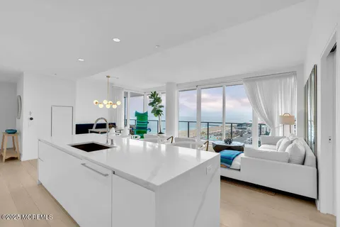 a spacious bedroom with a large bed and a flat screen tv