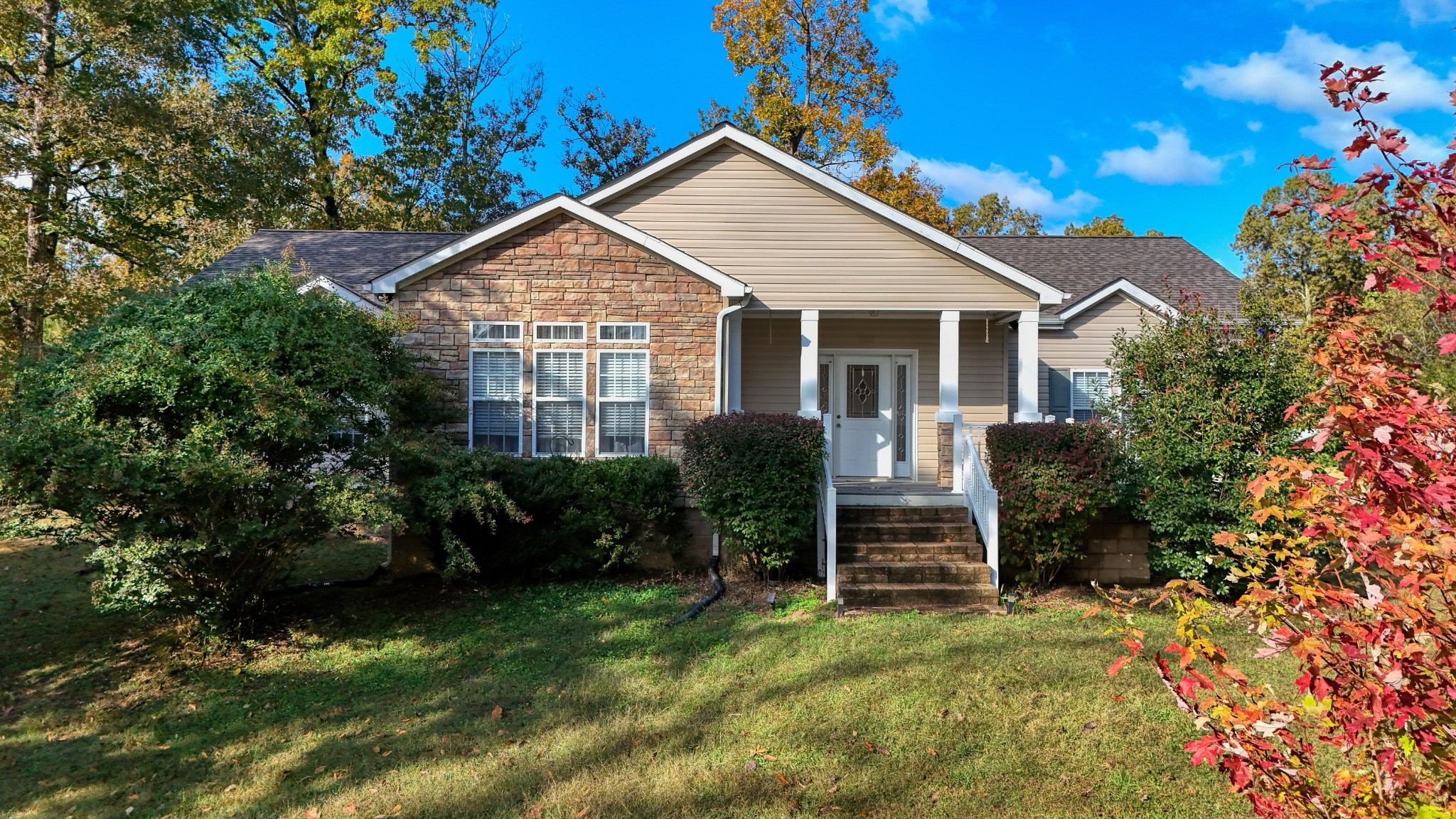a front view of a house with a yard