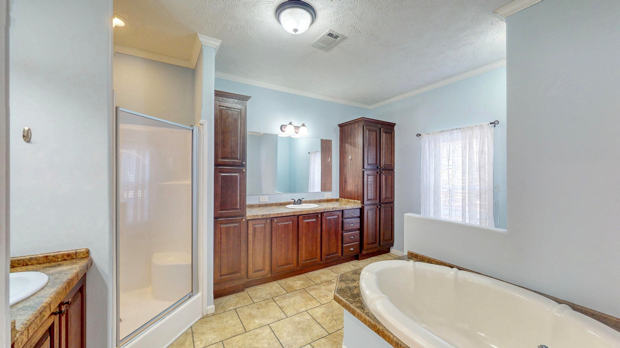 555 Brandon Road Huntingdon, TN 38344 - Photo 28 of 42 a spacious bathroom with a tub sink and mirror