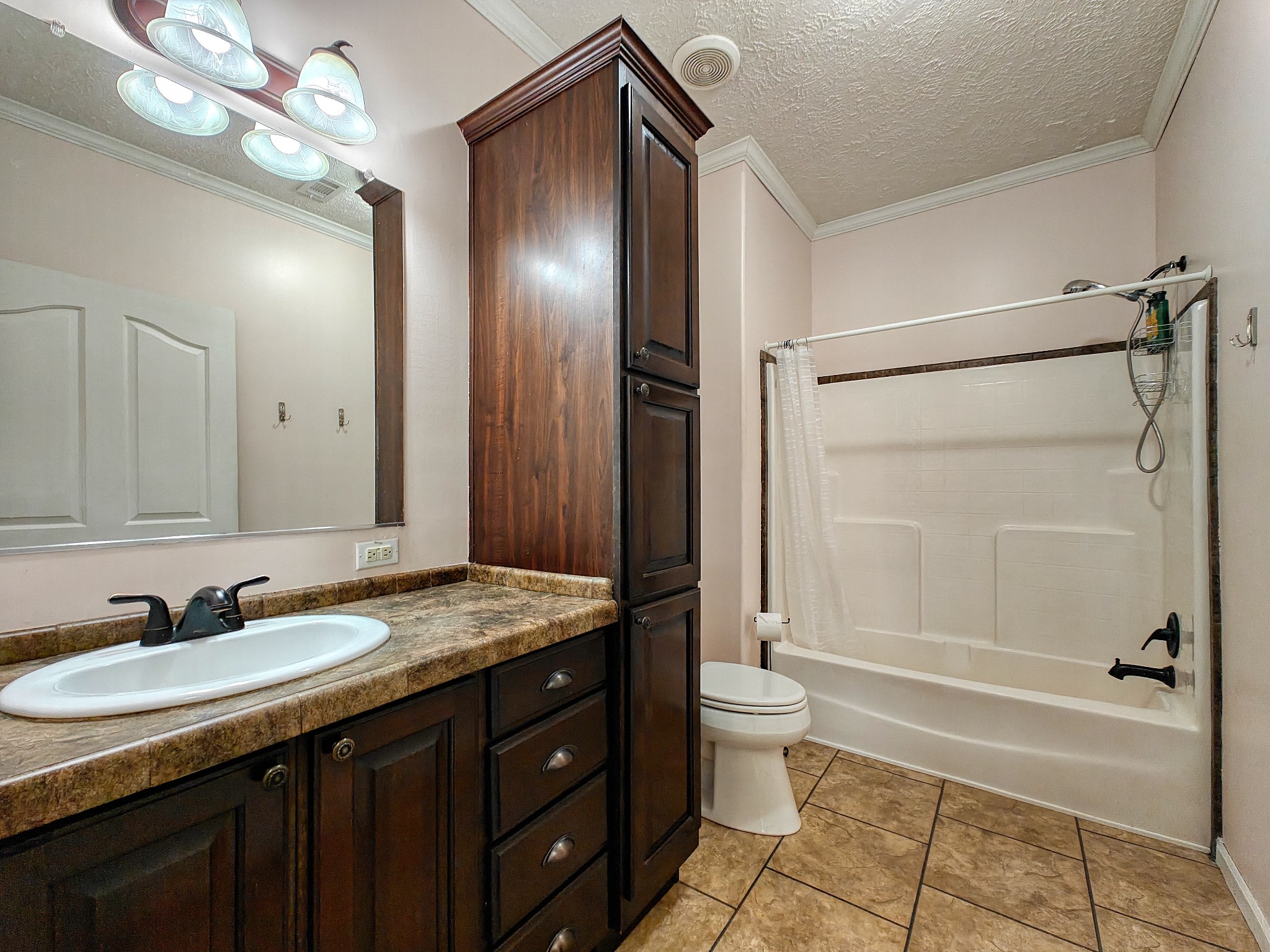 555 Brandon Road Huntingdon, TN 38344 - Photo 32 of 42 a bathroom with a granite countertop sink toilet mirror and bathtub