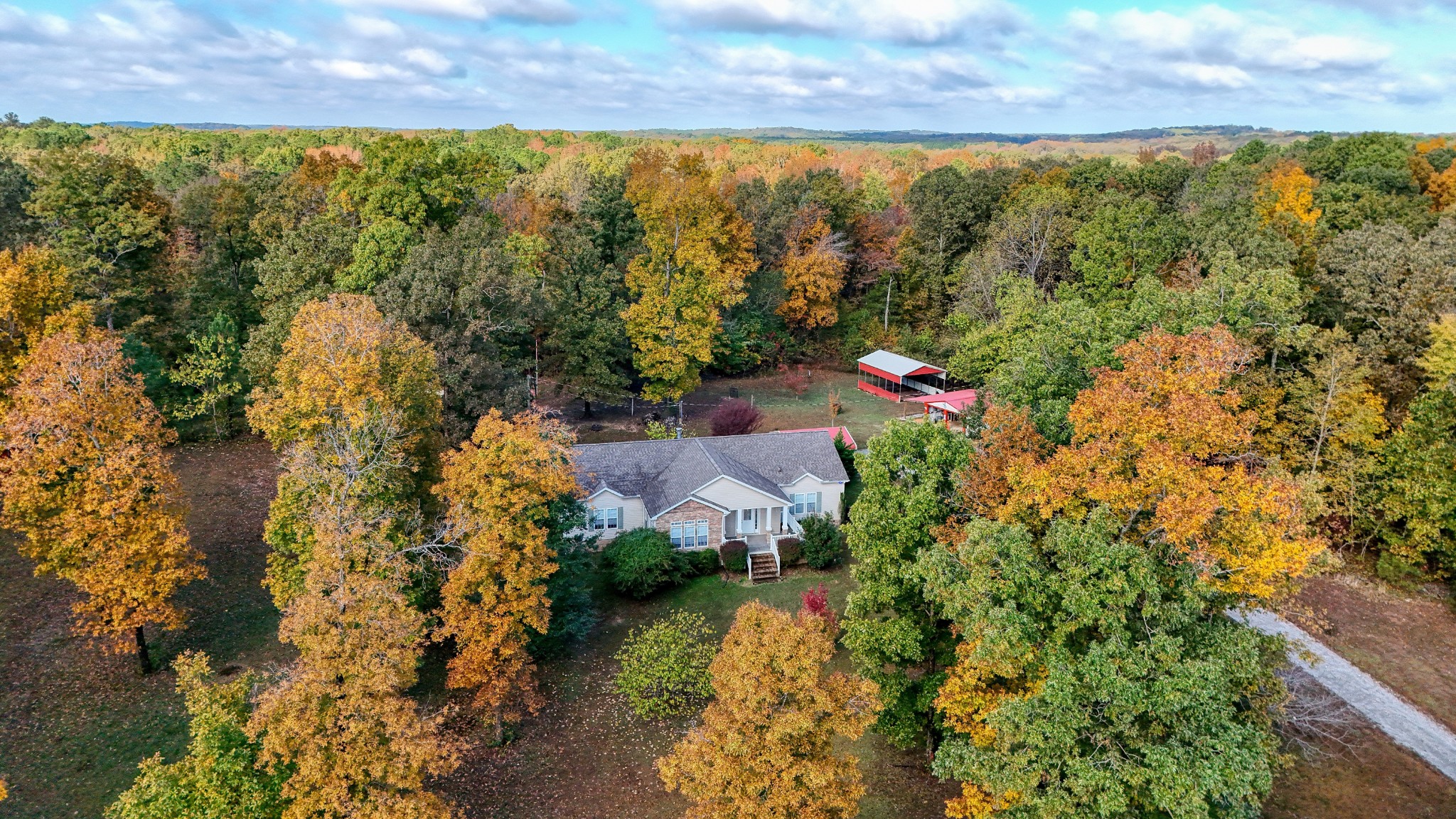 555 Brandon Road Huntingdon, TN 38344 - Photo 4 of 42 an aerial view of residential houses with outdoor space and trees