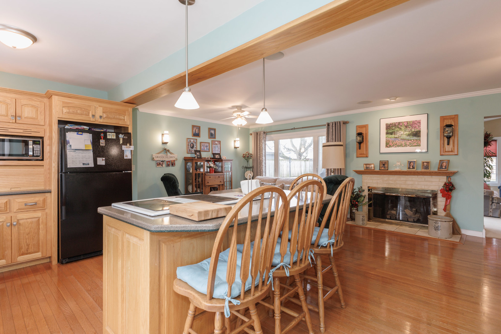 305 Granada Road Bloomington, IL 61701 - Photo 11 of 36 a dining room with furniture and wooden floor