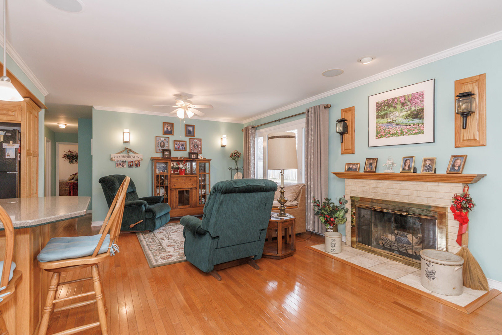 305 Granada Road Bloomington, IL 61701 - Photo 12 of 36 a living room with furniture and a fireplace