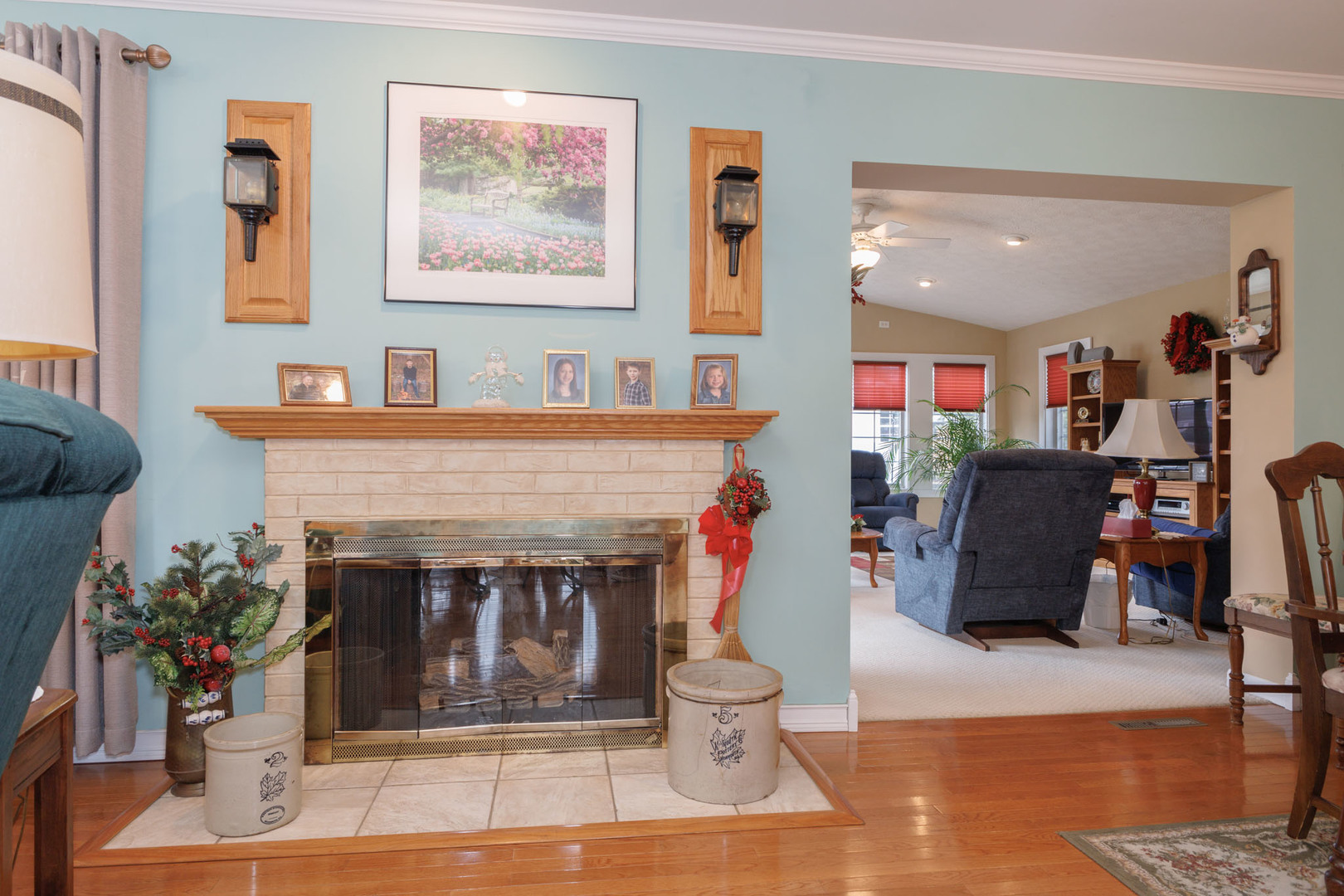 305 Granada Road Bloomington, IL 61701 - Photo 13 of 36 a living room with furniture and a fireplace