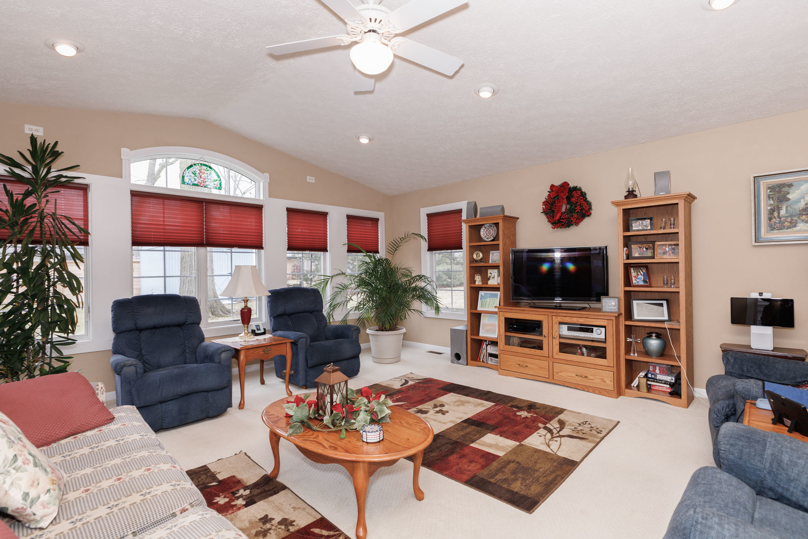 305 Granada Road Bloomington, IL 61701 - Photo 17 of 36 a living room with fireplace furniture and a flat screen tv