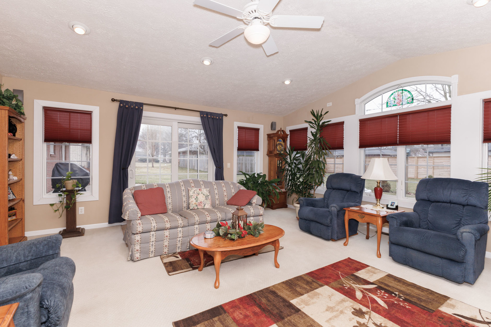 305 Granada Road Bloomington, IL 61701 - Photo 18 of 36 a living room with fireplace furniture and a rug