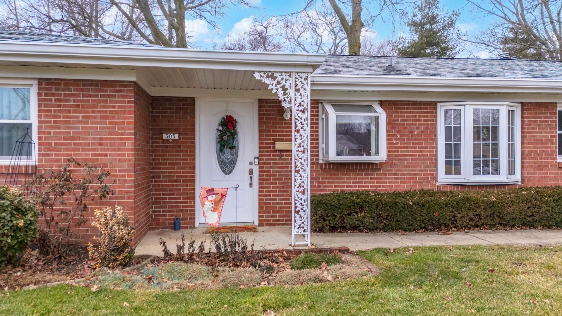 305 Granada Road Bloomington, IL 61701 - Photo 2 of 36 a front view of a house with a yard
